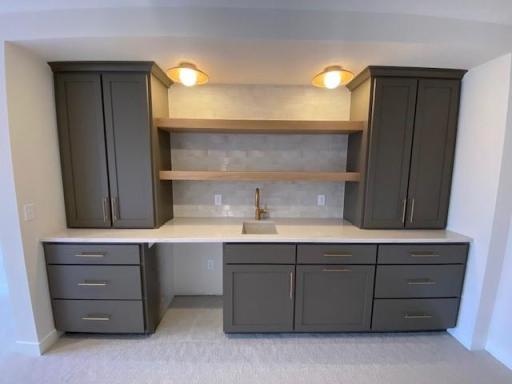 Finished lower level features beautiful custom wet bar, beverage fridge to come.