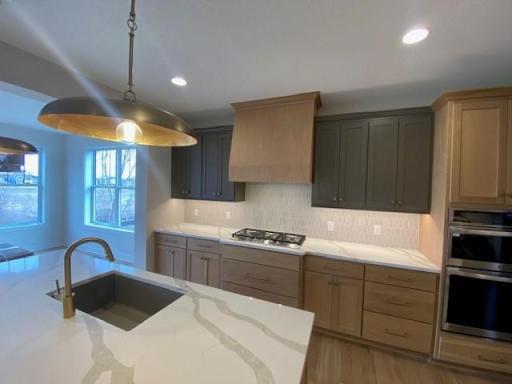 Our newest Robert Thomas Homes model in beautiful Riverwalk in Dayton is almost complete! A sneak peek....Stunning kitchen with Custom Cabinetry, wall ovens, gas cooktop & stunning custom Hood & spacious center island, plus walk-in Pantry & beaut