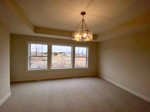 The Spacious Owner's suite features, double doors opening to amazing backyard views, box vault, over-sized walk-in closet, and lovely spa-like bathroom.