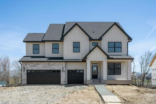 Our newest Robert Thomas Homes model in beautiful Riverwalk, Dayton is now finished & Open ! Large front porch, spacious 3-car garage, walkout lot! 5 or 6 bedrooms, office, & finished lower level & 2nd floor Bonus Room, too! Landscaping coming soon!