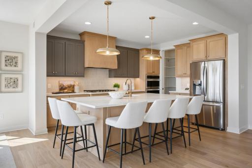 Our newest Robert Thomas Homes model in beautiful Riverwalk, Dayton! Stunning kitchen w/Custom Cabinetry, wall ovens, gas cooktop & custom Hood, spacious center island, pantry: Enjoy cooking & entertaining in this beautiful kitchen! Move right in!