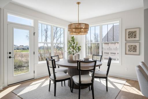 Spacious sun-filled dining room, beautiful backyard views.