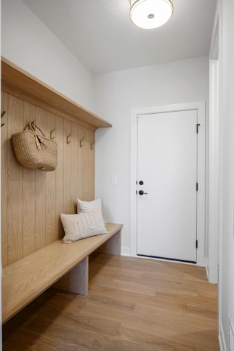 Large mudroom with custom built-in bench and walk-in closet: for beautiful organization for everyday!
