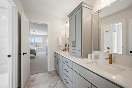 Jack-n-Jill dual sink bathroom connects two bedrooms and separate tub/toilet room.