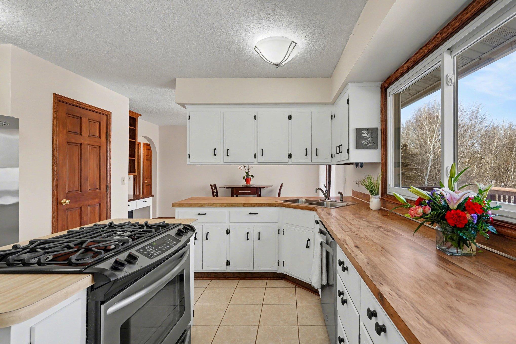 Chef’s dream! Massive counter space for prep and serving. Features stainless steel appliances, a double sink, and a center island equipped with a gas stove and convection oven. Additional storage in the pantry. Perfect for hosting!