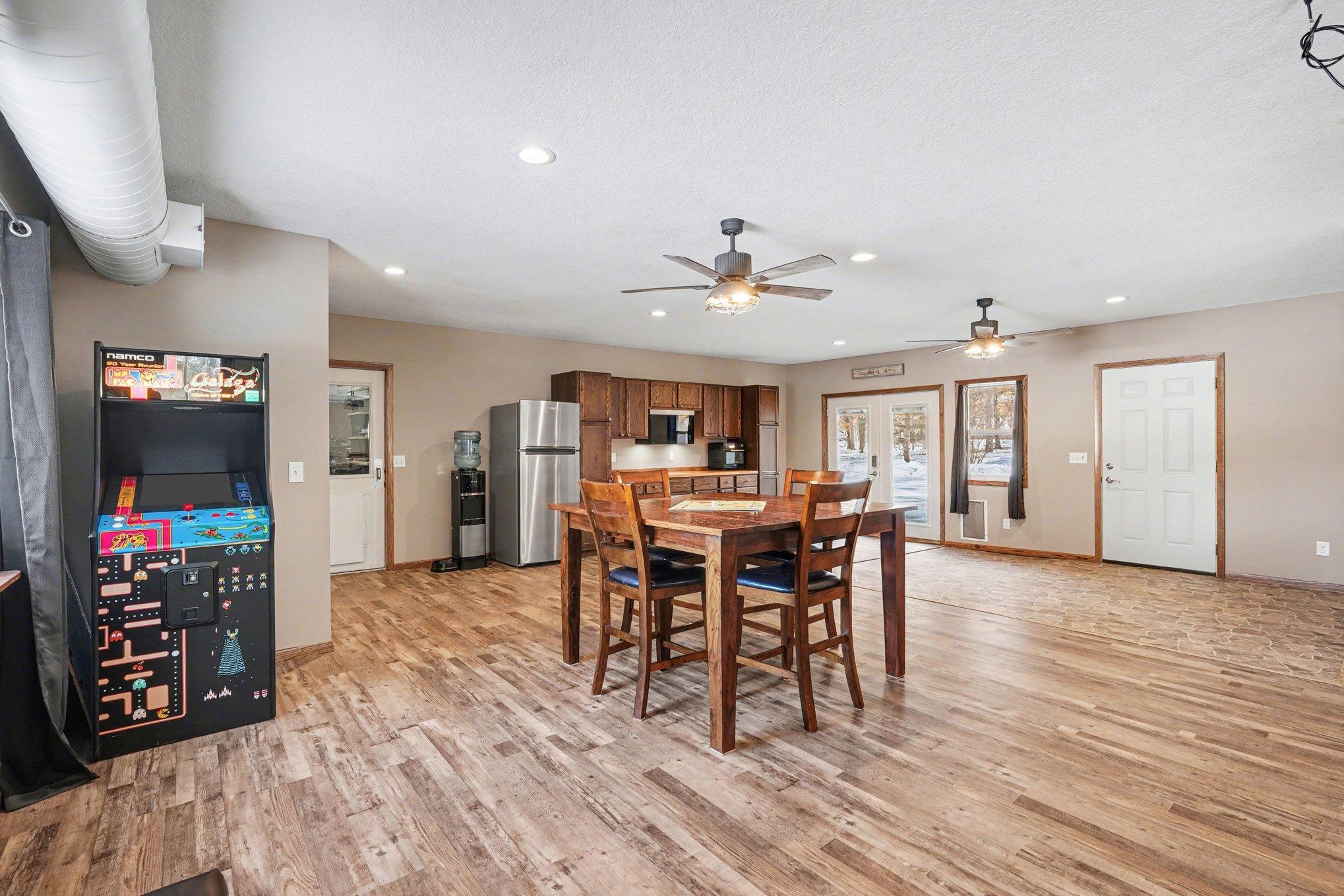 The shop is attached to the 2-car & the 4+ car garage (rebuilt in 2023). The 4+ car incl 12' insulated doors, a back insulated pull-through door, abundant storage, 200-amp elect srv, sheetrock & insulated ceiling, exterior 30 amp RV hook-up.