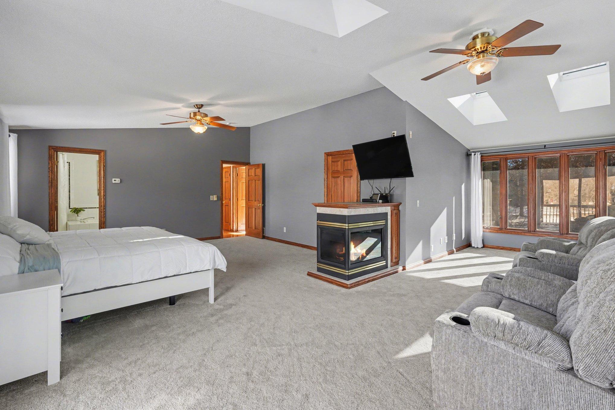 So much more than just a bedroom! This massive space offers room for a sitting area, library, desk, or exercise equipment. Sun-drenched & beautiful views of the private, 3.8-acre yard from every window