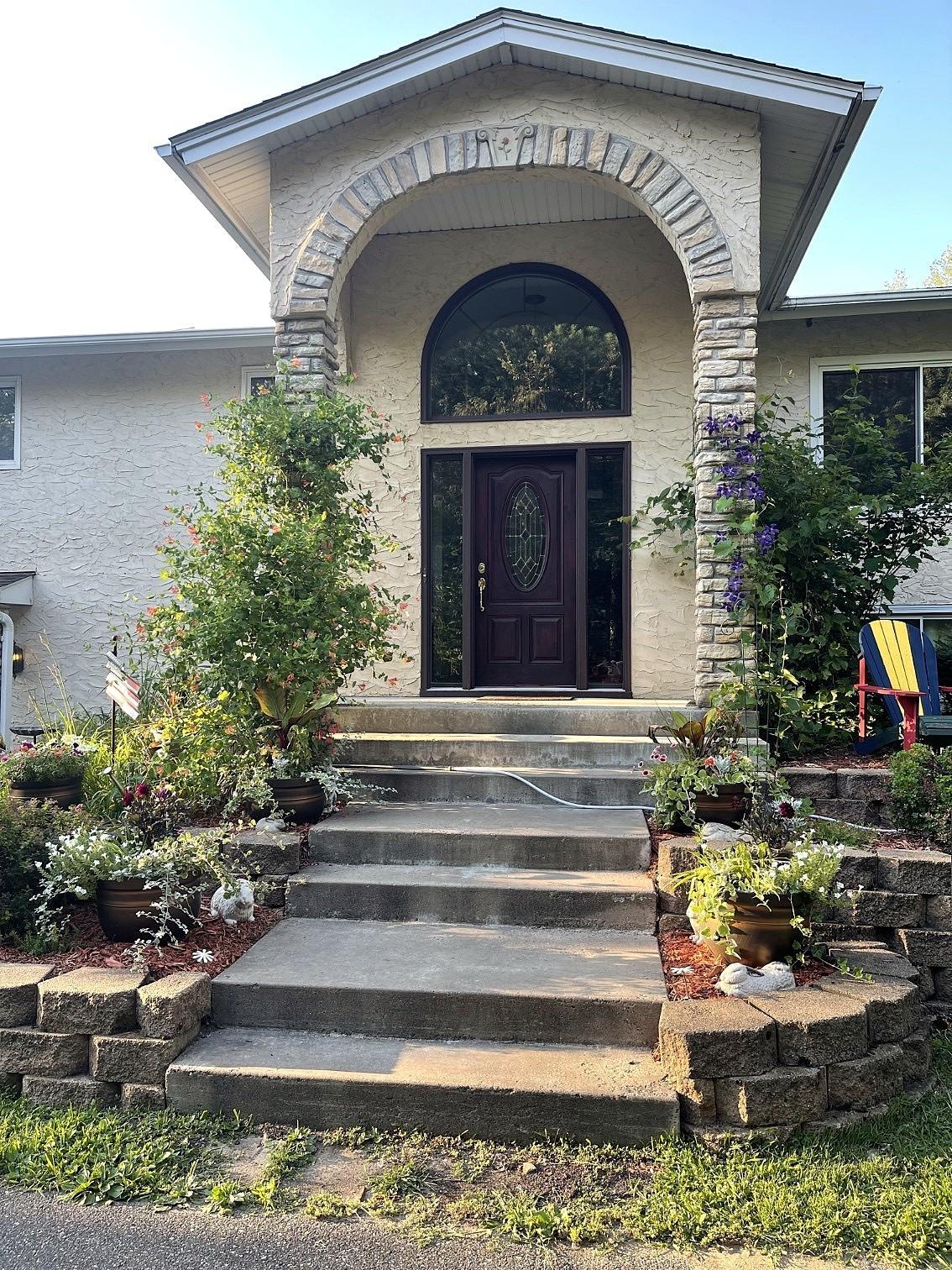 Grand entrance with beautiful perennial gardens.