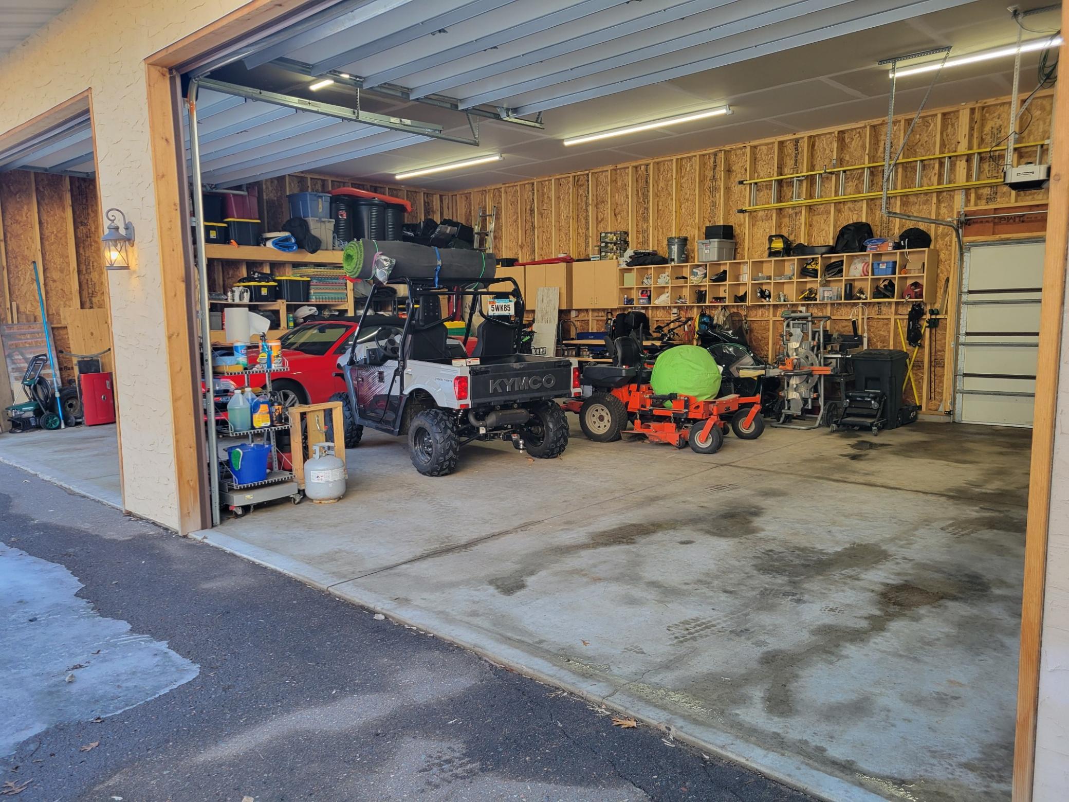 Massive 4-car garage that was rebuilt in 2023. Includes 12' insulated doors with Smart IQ openers, loads of storage, sheet-rocked & insulated ceiling, motion lights, 200-amp electrical service & 30-amp electrical service outside for RV hook-up.