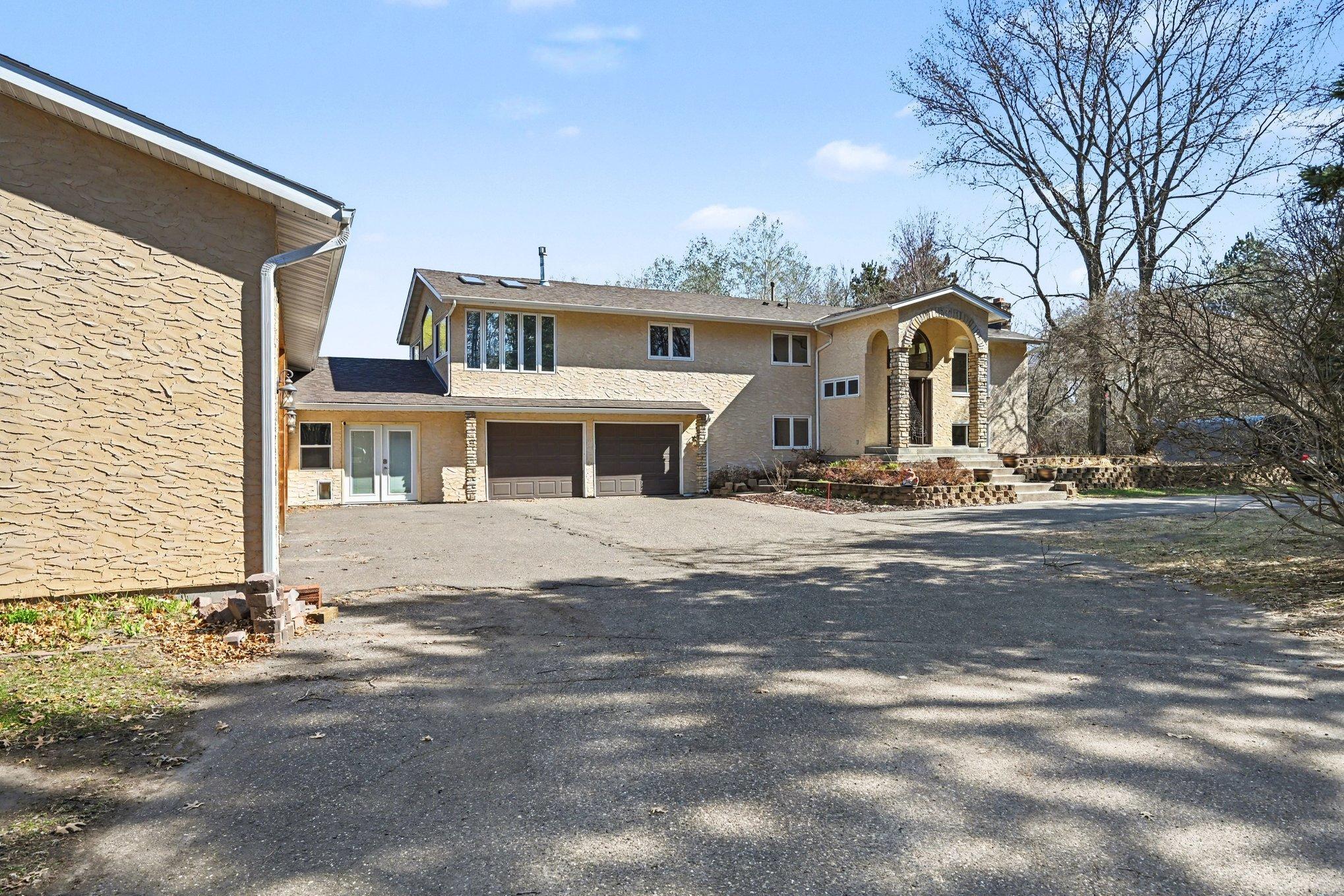 Incredible space & storage! This private oasis features a main house, a massive 1,200-sf finished shop, & ample garage space. All situated on a beautiful, wooded lot with a pond—the ultimate sanctuary for hobbyists and nature lovers.