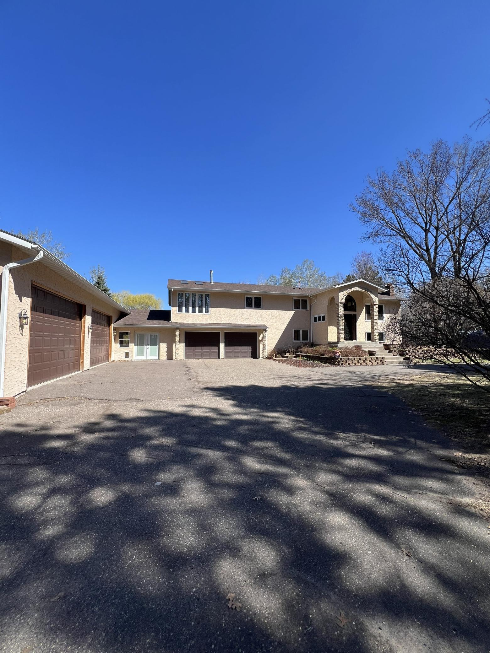 Don't miss this GEM nestled on a private 3.8 acre wooded lot. Feel like you're in your own retreat with convenient freeway access. You won't believe the beautiful show/entertainment area and huge 4-car garage. This home is special.