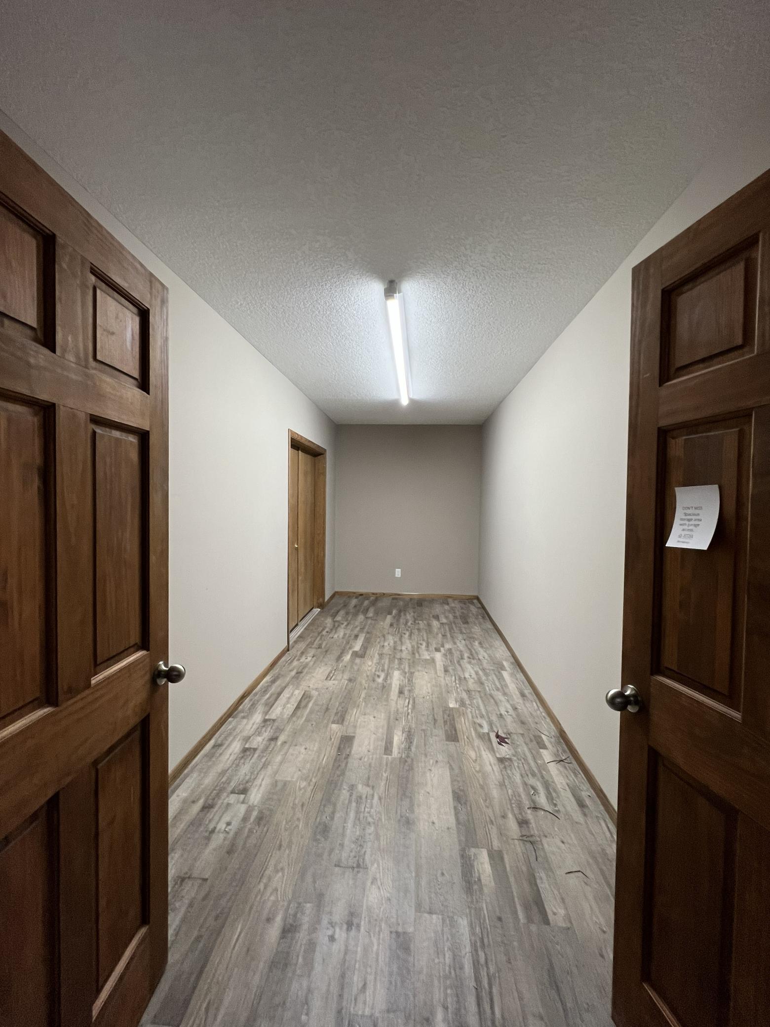 There's a 19' x 7' storage room that features paneled French doors and another access to the 4-car garage.