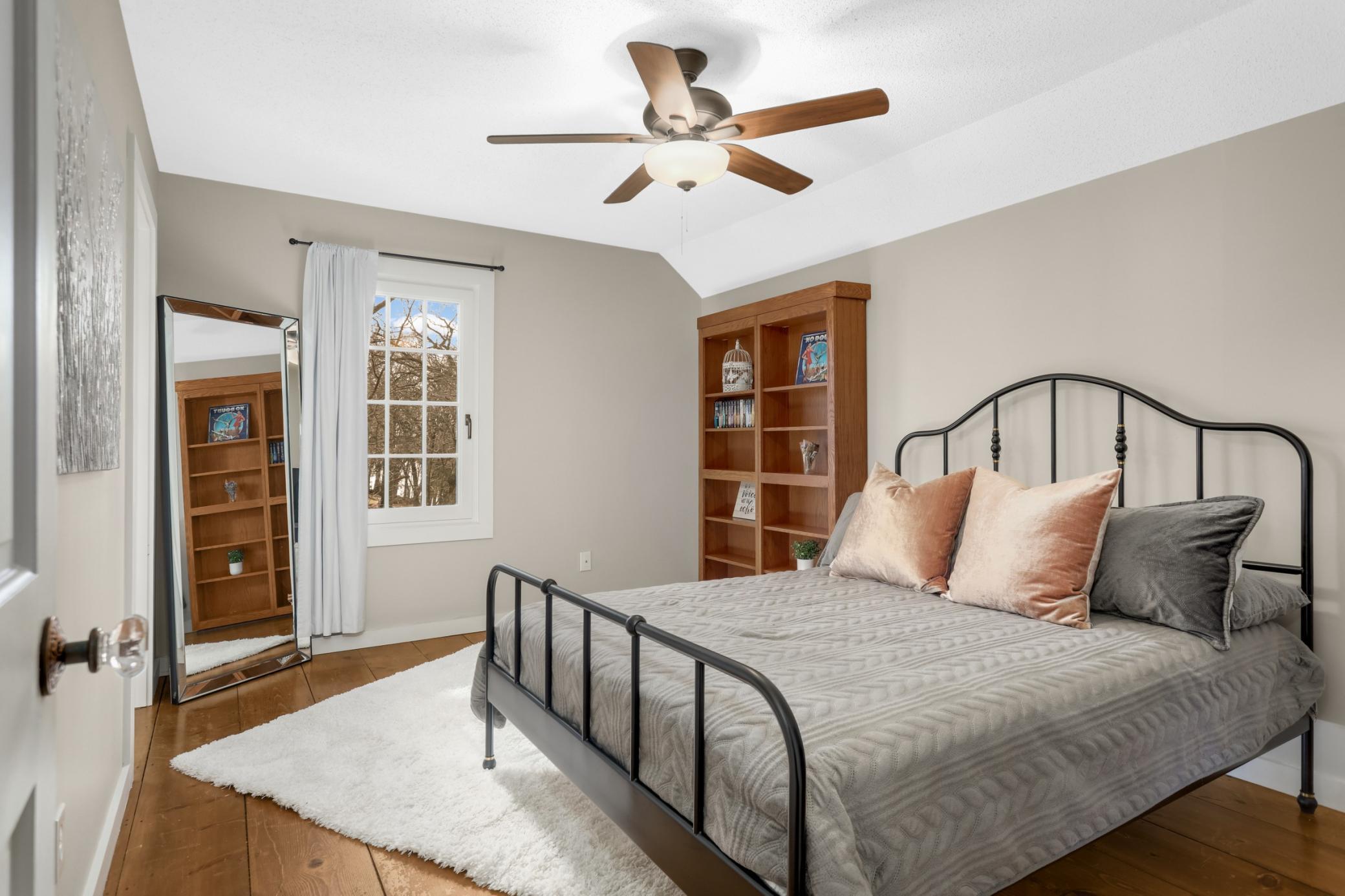 Upper Level bedroom #2 with walk in closet and hidden room behind bookshelf