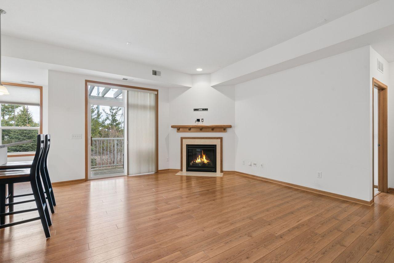 Gas fireplace, private deck, hardwood floors