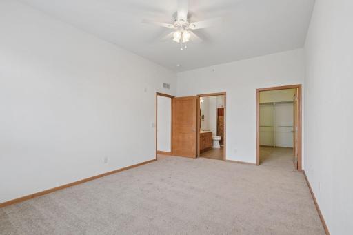 Primary bedroom with ensuite bath and spacious walk-in closet