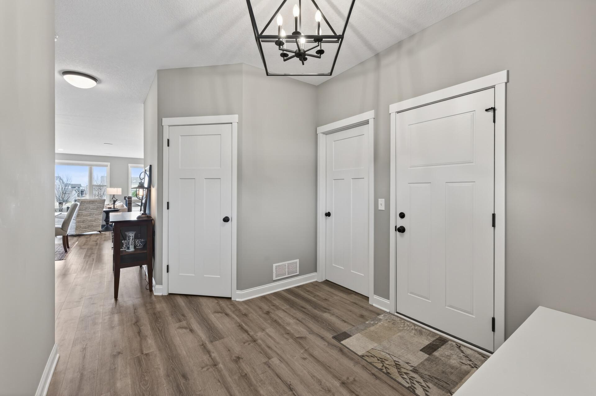 Spacious foyer area with access to garage, a large walk-in closet and laundry room.