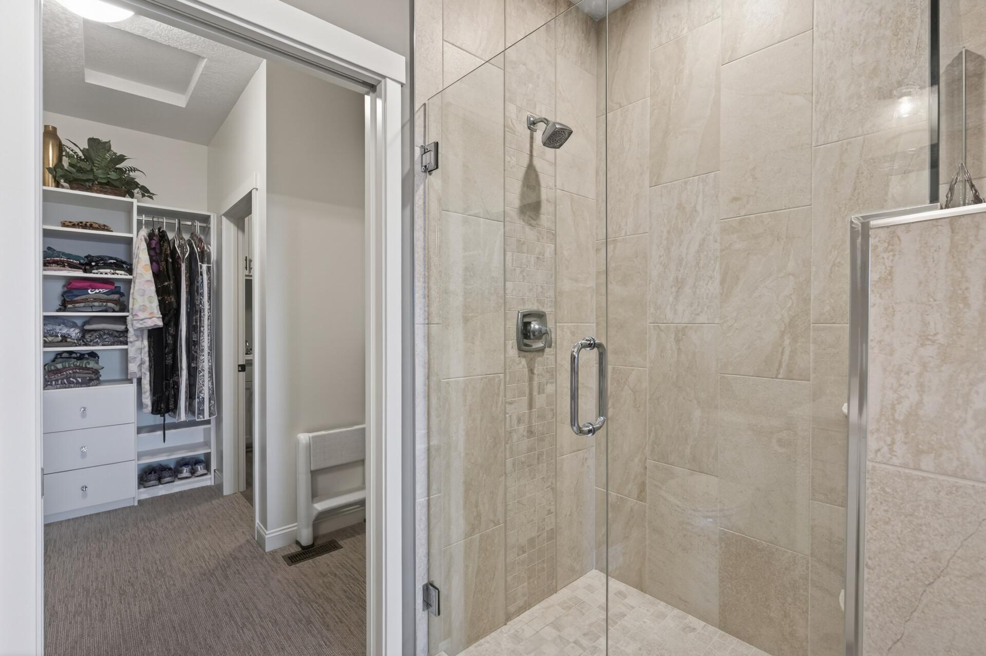 Fully tiled shower with frameless glass door