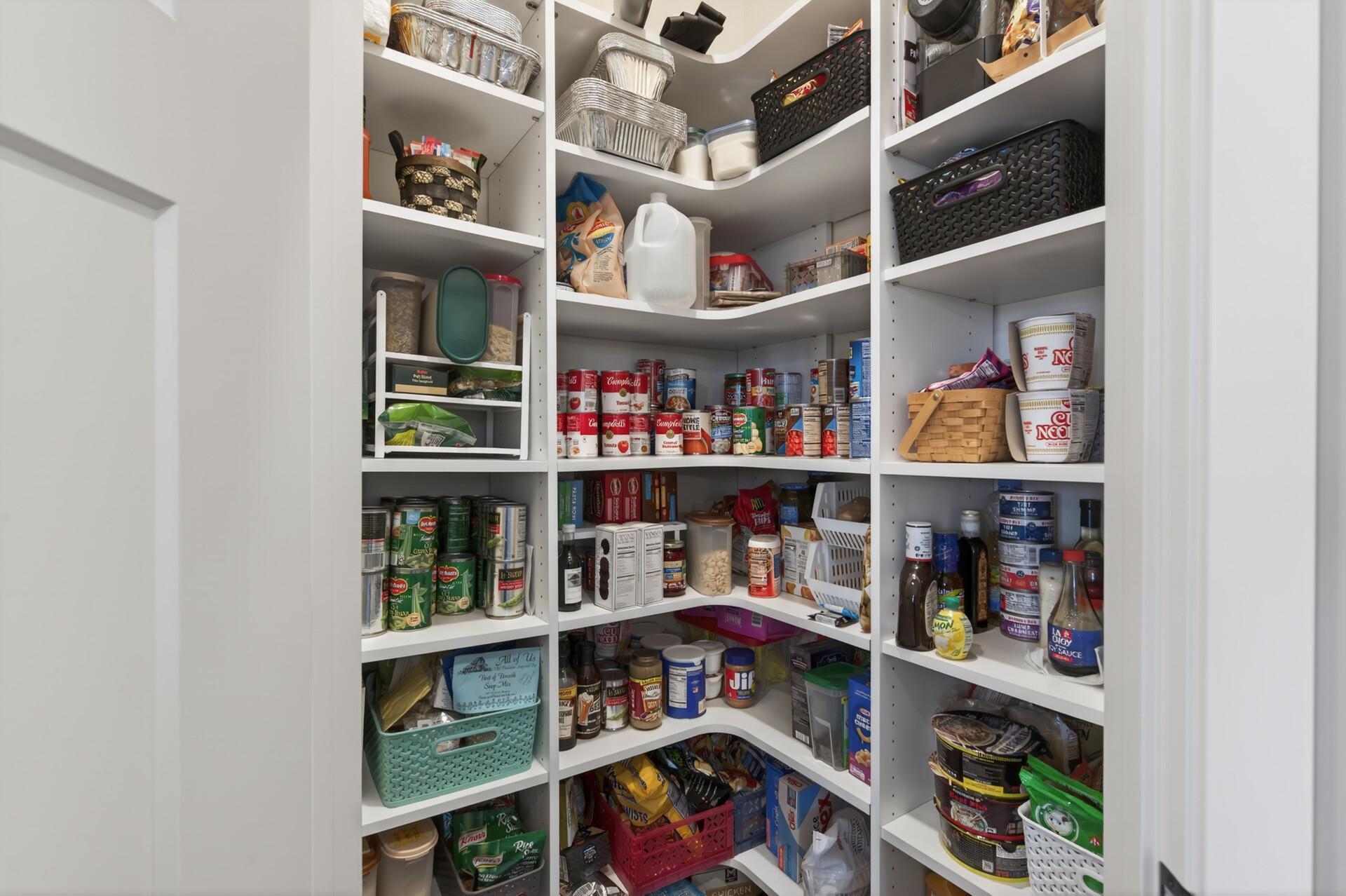 Kitchen also offers an expansive corner pantry with upgraded shelving!