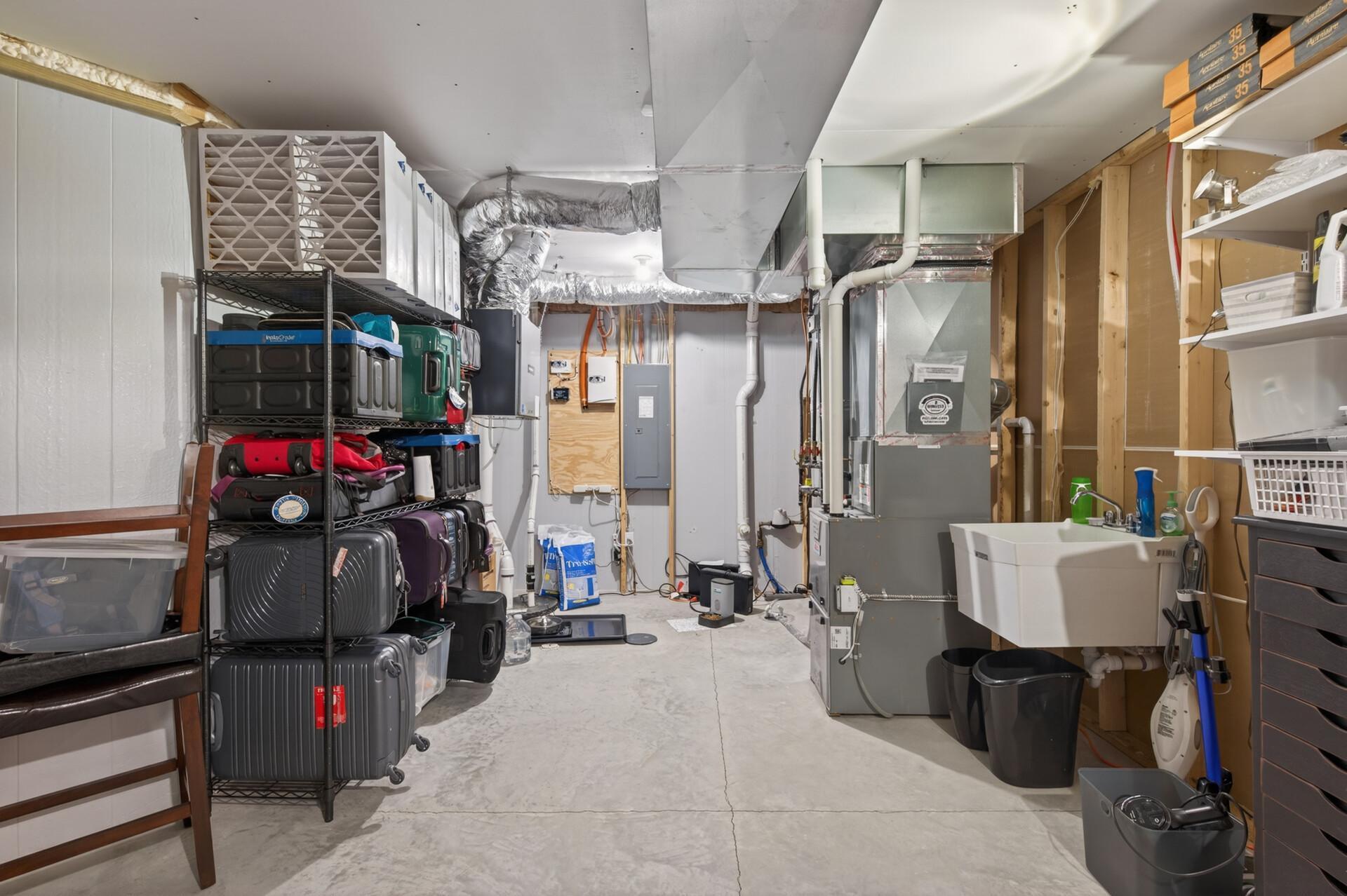 The mechanical room is extremely spacious and offers tons of storage!