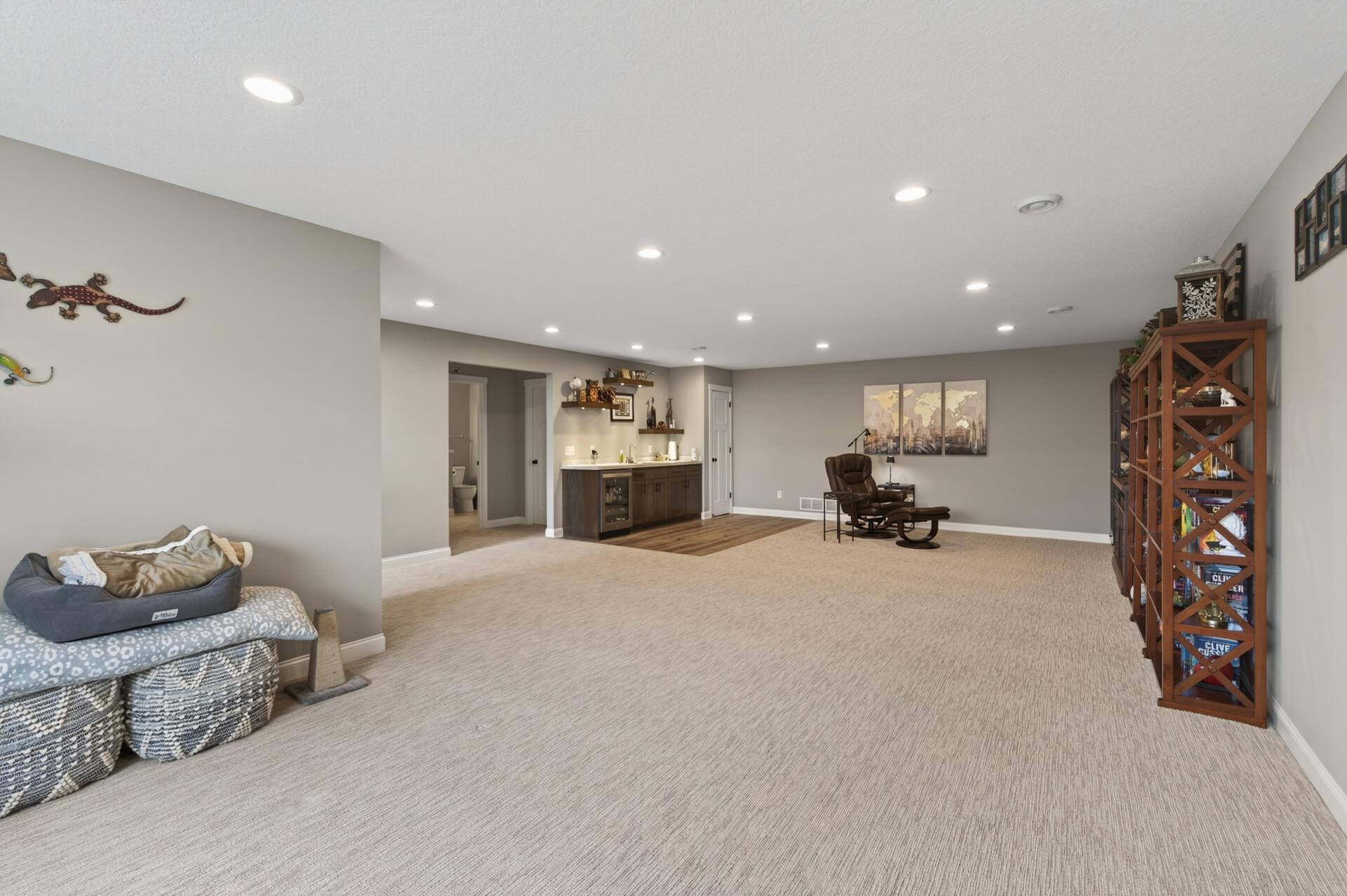 Lower level space also offers a wet bar and small pantry