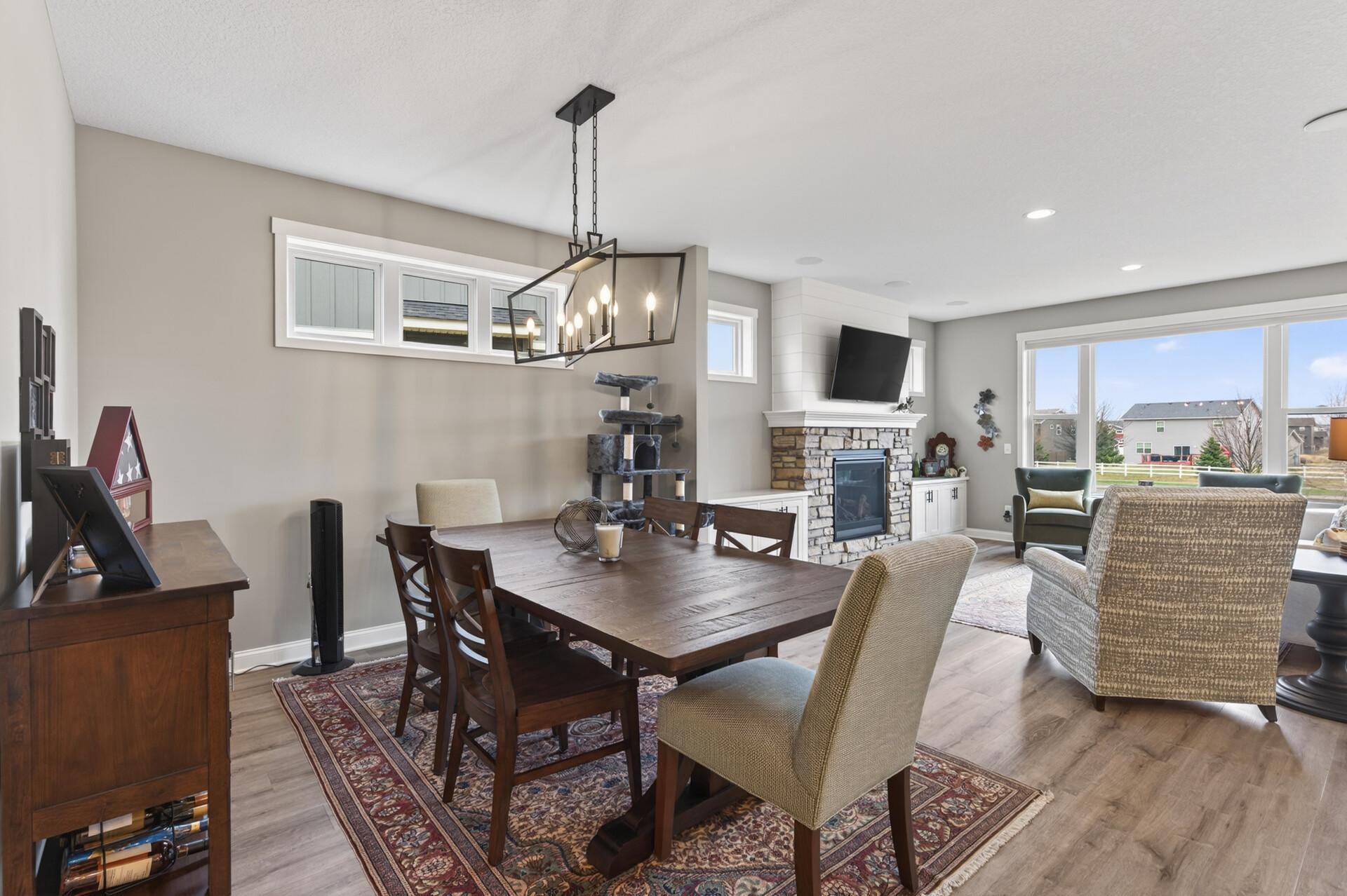 Down a small hall, we have the open concept dining, living and kitchen areas