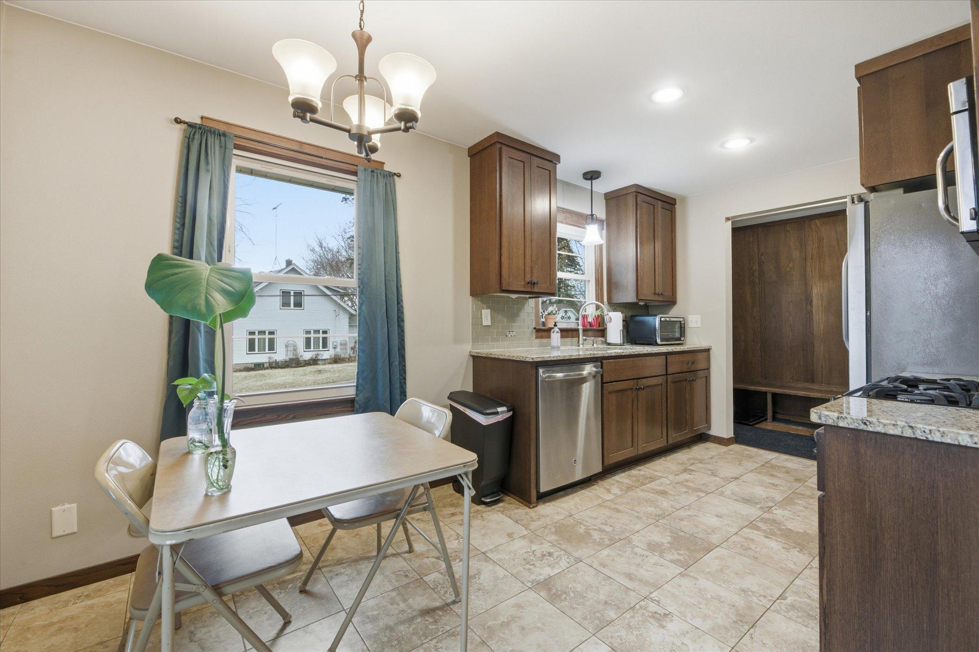 Recently remodeled galley kitchen featuring stylish finishes and updated fixtures.