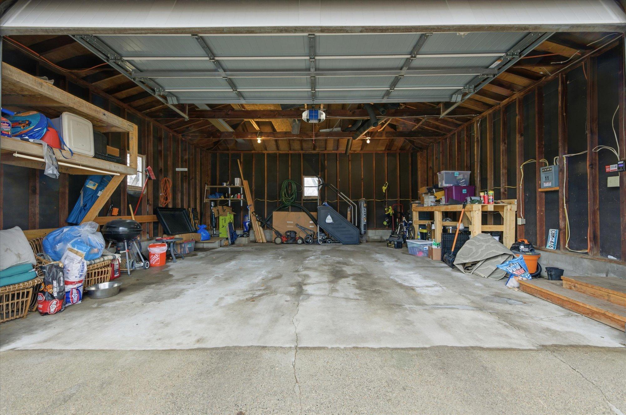 Oversized two-car garage with extra space for storage or a workshop.