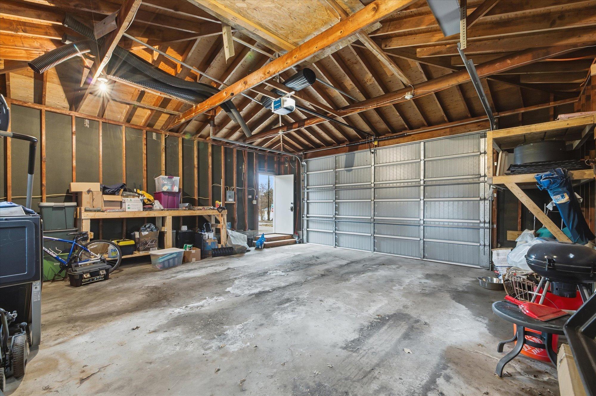 Oversized two-car garage with extra space for storage or a workshop.
