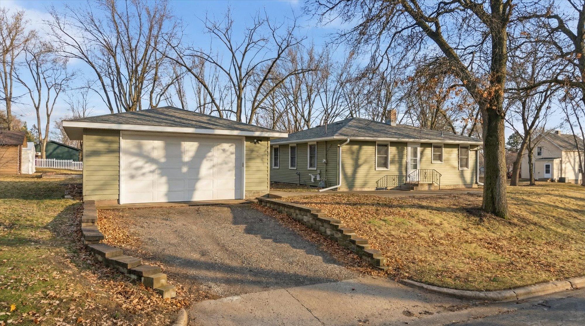 Welcome home to this charming property featuring an oversized two-car garage, mature trees, and a large corner lot.