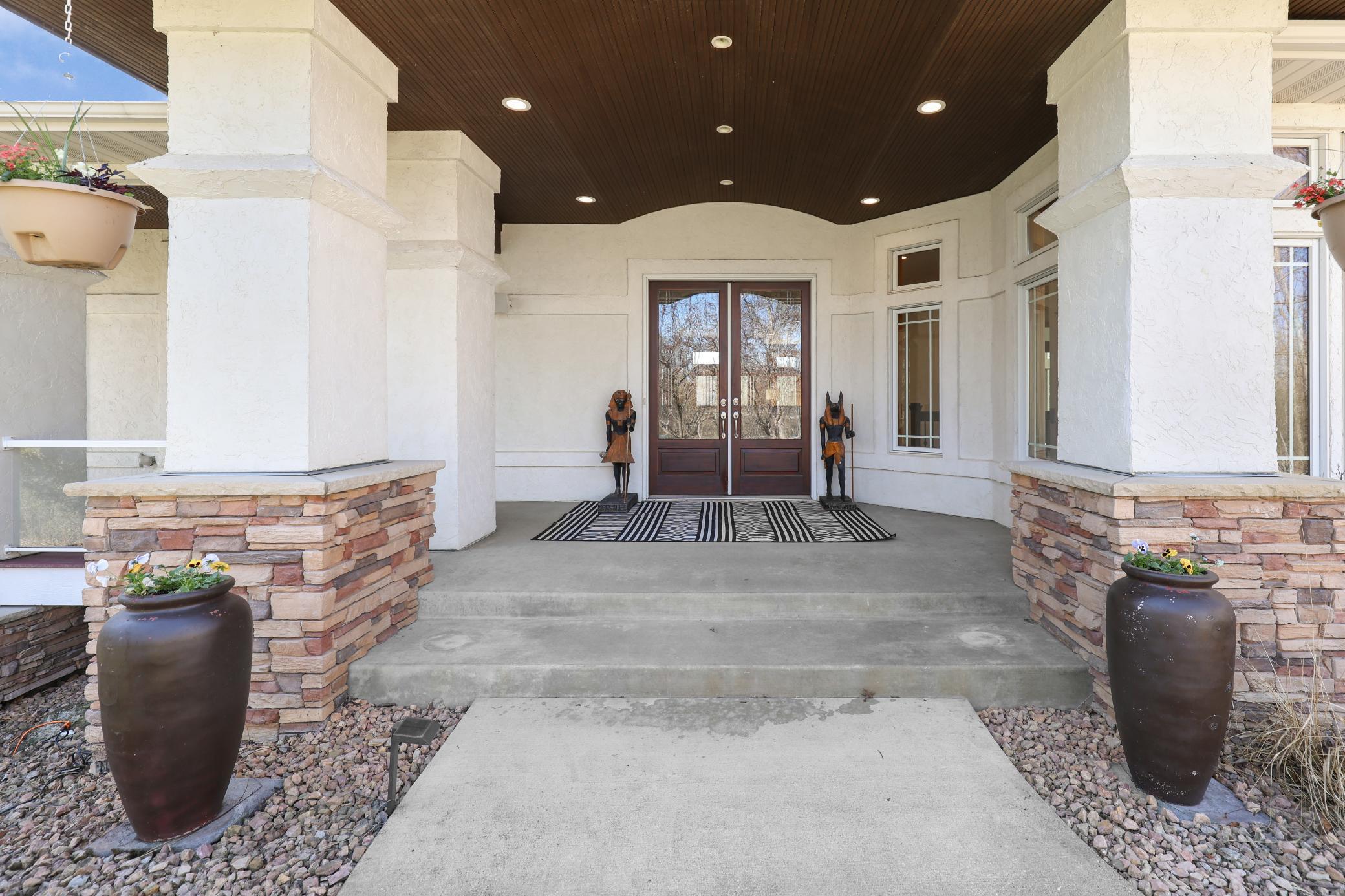 A grand, welcoming entry framed by distinctive design elements that set the tone from the moment you step inside.