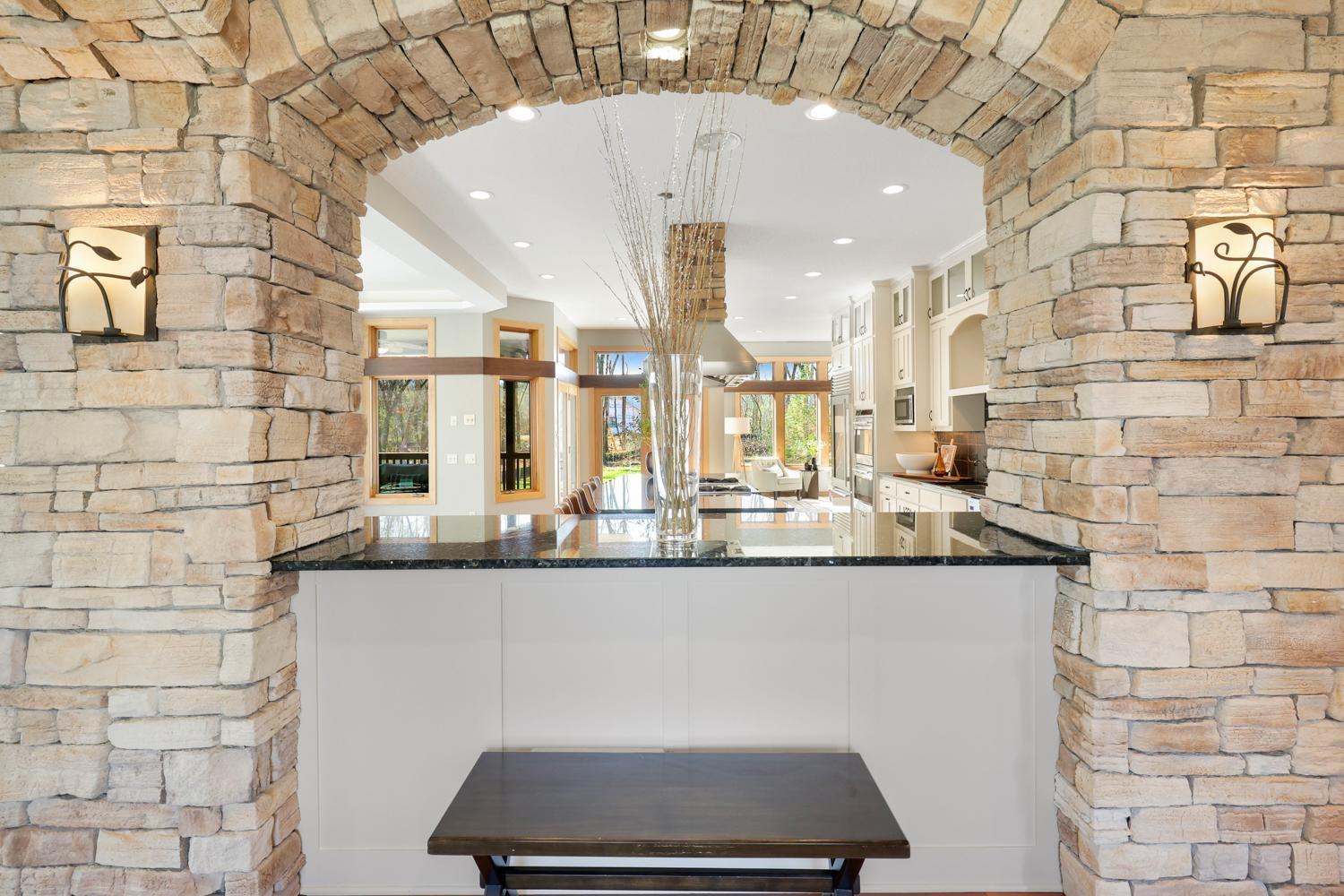 Impressive custom stone arch greets you!