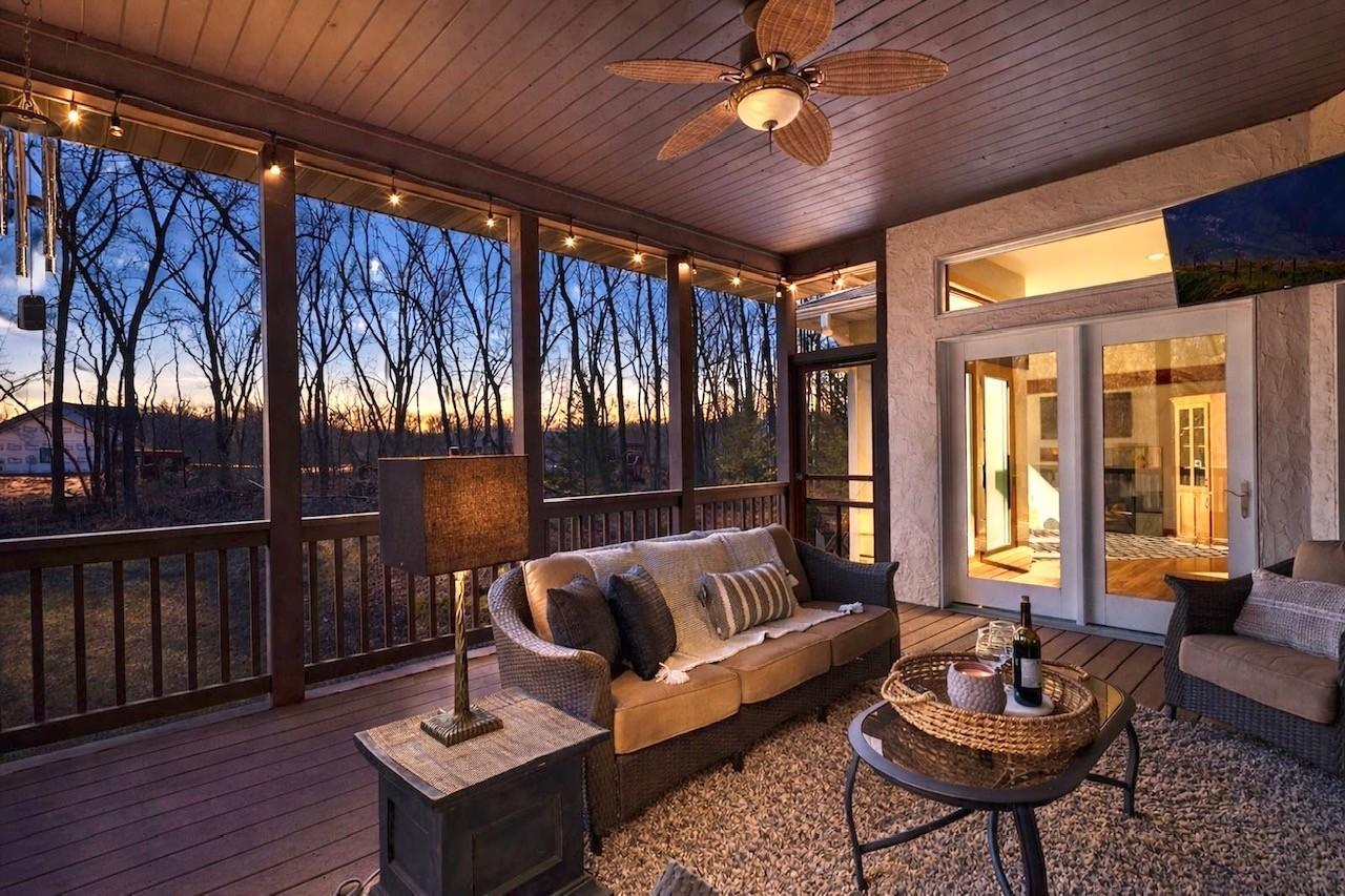 Relax on the screened porch and take in the peaceful natural surroundings.
