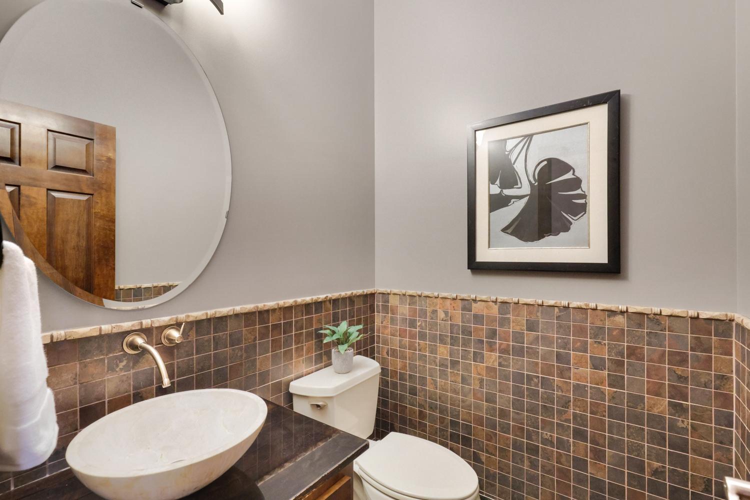 Main level bath just down the hall from the kitchen and living room.