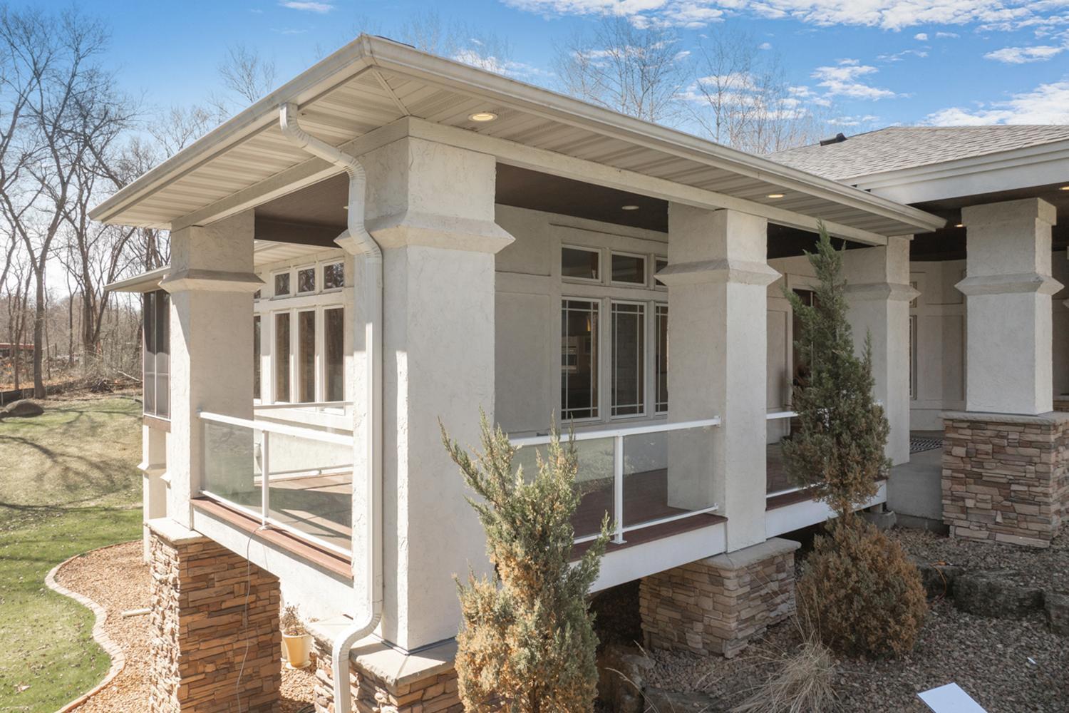 Strong architecture with a wraparound deck off the main entry.