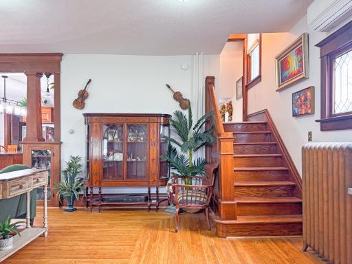 Entrance to Living Room and original wood staircase