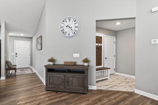 Everyday organization is made easy with a functional mudroom just off the garage entry. This custom hall tree with bench can stay with the home.