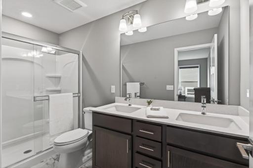 Double sinks, plenty of storage, and a clean modern design make mornings just a little easier.