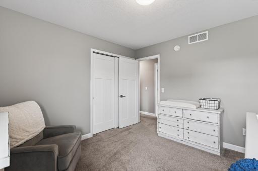 Bright, comfortable, and versatile. One of three upper-level bedrooms designed to grow with your needs.