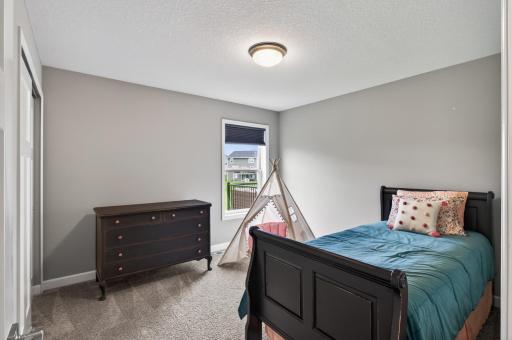 Another generously sized bedroom offering plenty of space for family, guests, or a dedicated workspace.