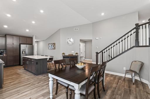Open dining space flows seamlessly into the kitchen and living areas.