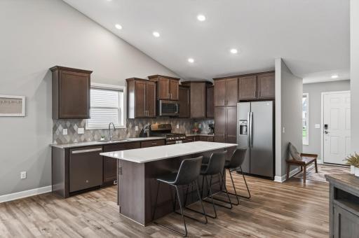 Dark cabinetry paired with bright finishes creates a timeless and elegant look.