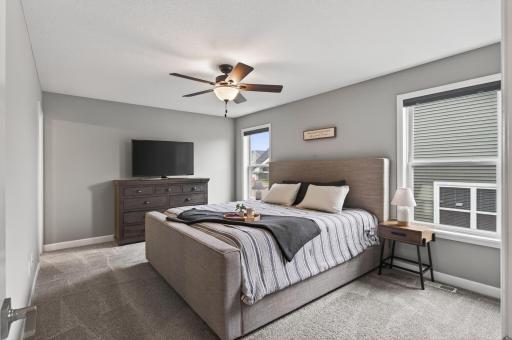 End the day in your own private retreat. Spacious, bright, and thoughtfully designed, the primary suite offers plenty of room to unwind.