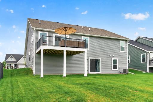 Step outside and enjoy wide-open views from the spacious deck overlooking the backyard and neighborhood green space.