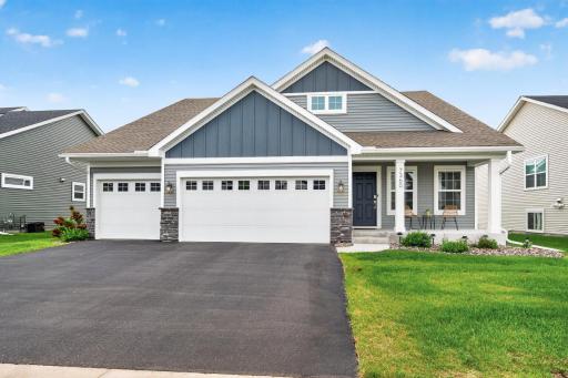 Welcome home to 7360 Crane Drive! Three-car garage, charming front porch, and curb appeal that stands out from the moment you arrive.