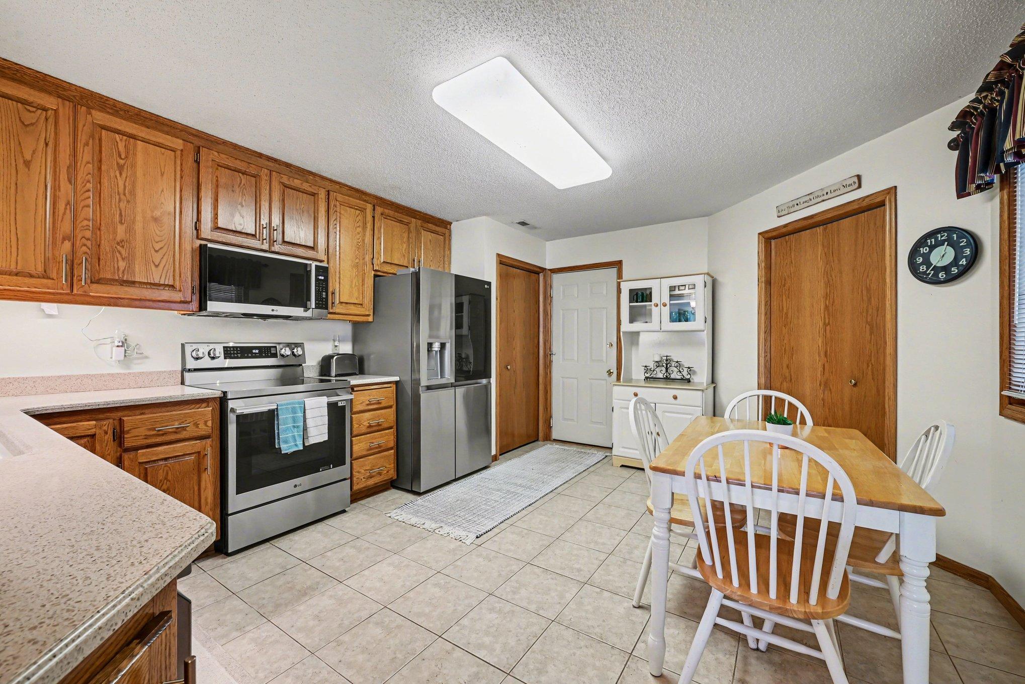 15x14 Kitchen: Tile floors, Stainless appliances, formica countertops