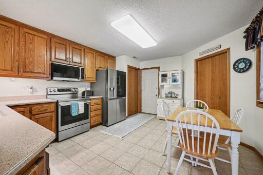15x14 Kitchen: Tile floors, Stainless appliances, corian countertops