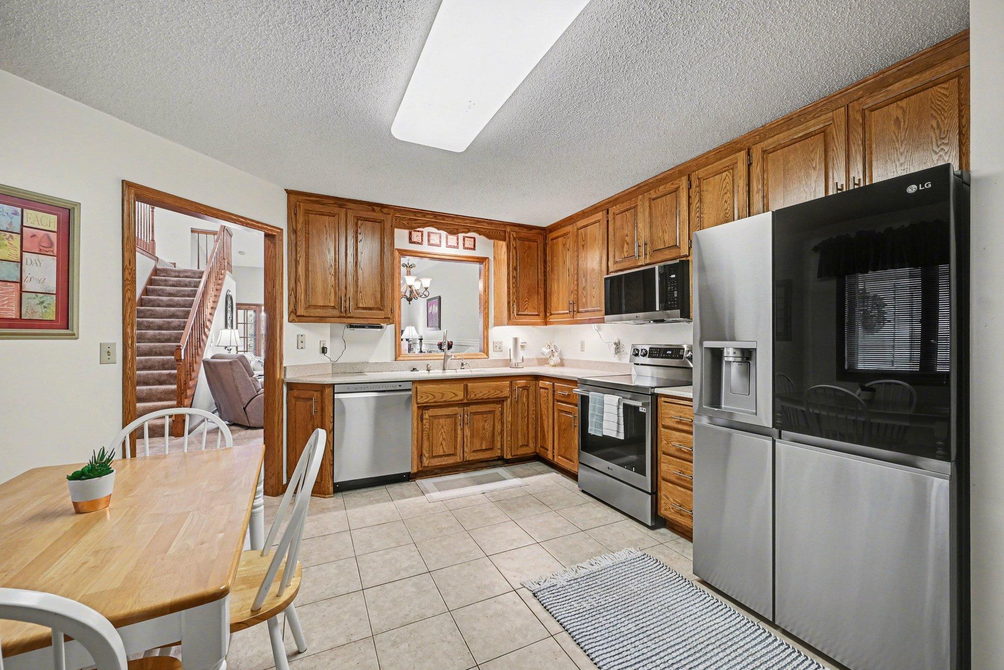 15x14 Kitchen: Tile floors, Stainless appliances, formica countertops