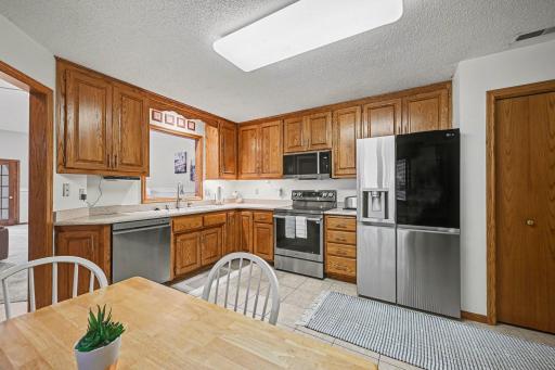 15x14 Kitchen: Tile floors, Stainless appliances, corian countertops