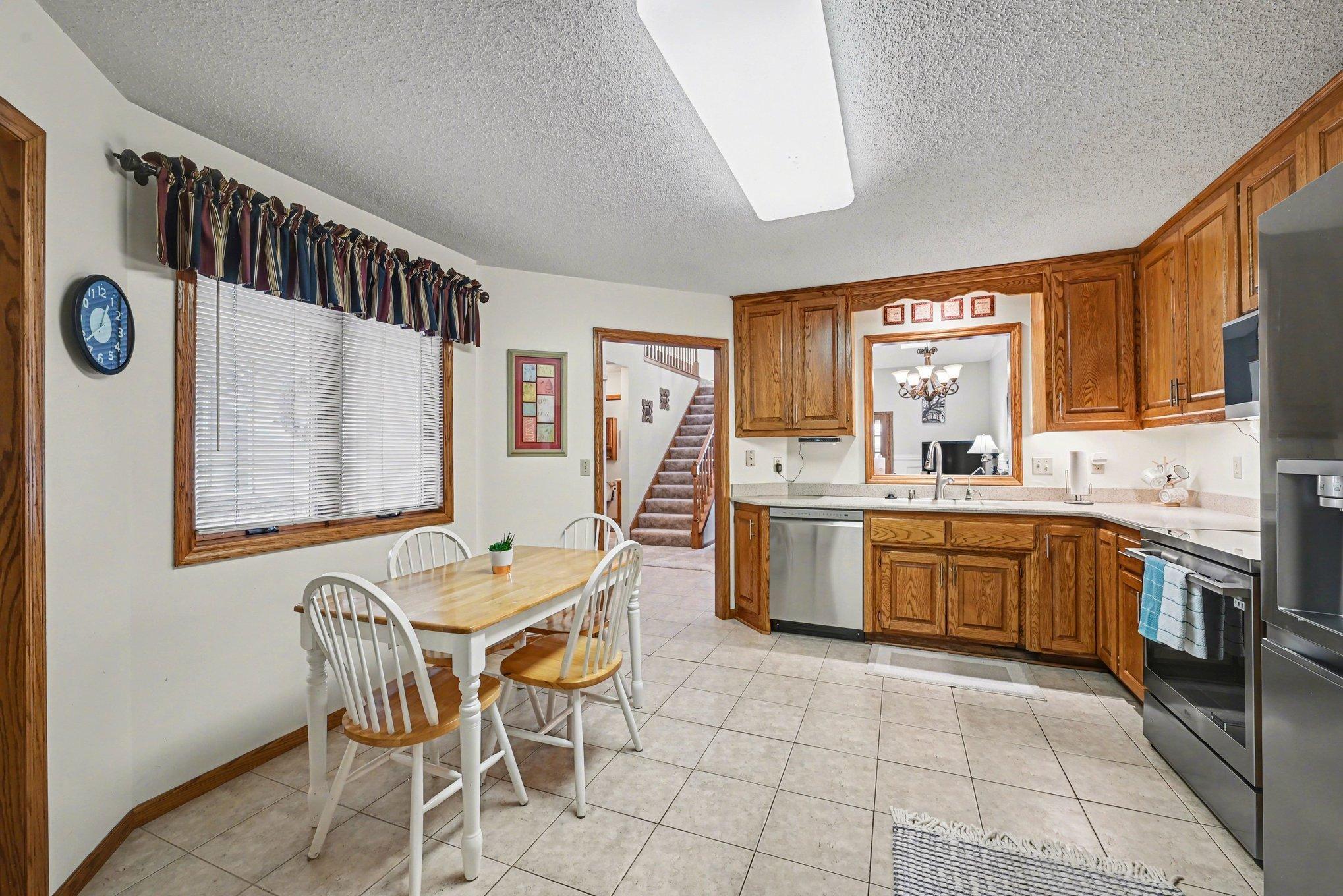 15x14 Kitchen: Tile floors, Stainless appliances, formica countertops