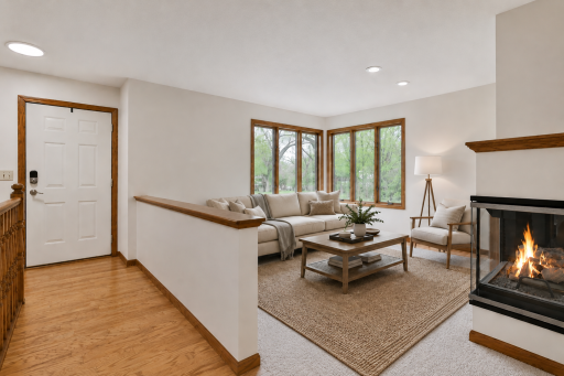 Living room with 2 sided fireplace (virtually staged)